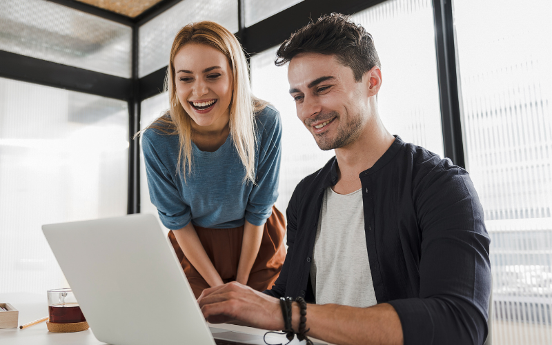 A woman helping a man with his hr support