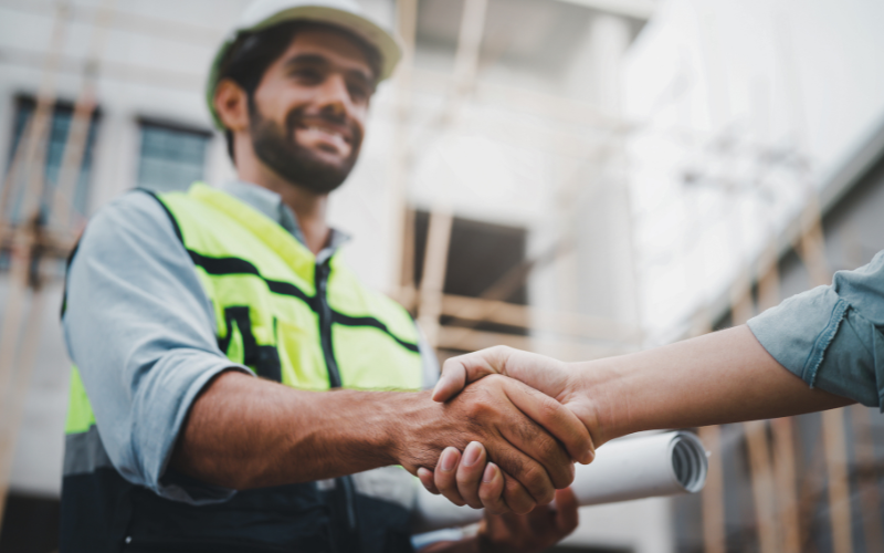 Two men shaking hands with each other for HR support