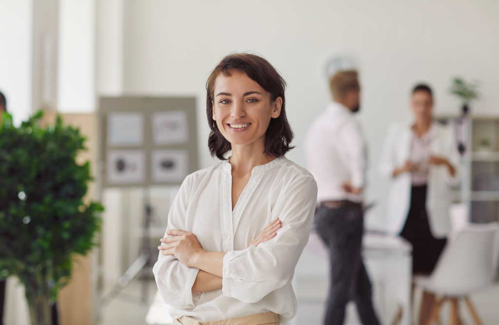 A woman smiling after hearing employment law tips